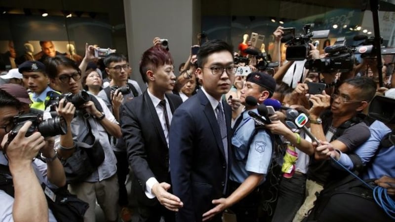 资料图片:2018年8月14日,香港民族党召集人陈浩天在香港外国记者会进行演讲,事件备受国际社会关注。(路透社)