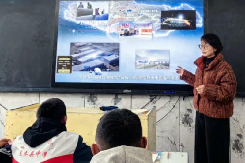 Students are shown videos of the Dingri earthquake relief work, to combine ideological and political education using examples of quake aid, at a school in Nyingtri county, Tibet, March 8, 2025.