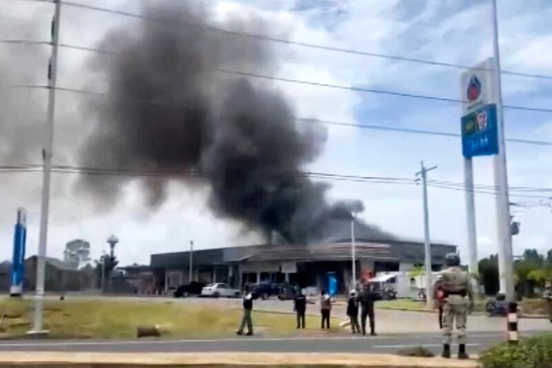 In this image made from video, smoke rises from a convenience store at a gas station, amid the clashes between Thailand and Cambodia, in Kantharalak district, Sisaket province, Thailand, July 24, 2025.