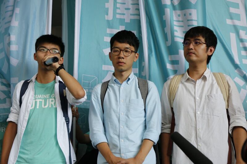 左起:黄之锋、罗冠聪及周永康。(资料图片)