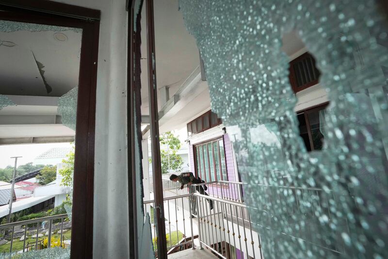 A Thai soldier stands at the Phanom Dong Rak hospital damaged by artillery shells during clashes with Cambodia in Surin Province, Thailand, July 25, 2025.
