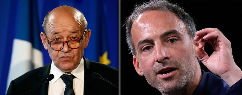 资料图片:法国外交部长勒德里安(左)和欧洲议会议员格鲁克斯曼。(美联社图片)