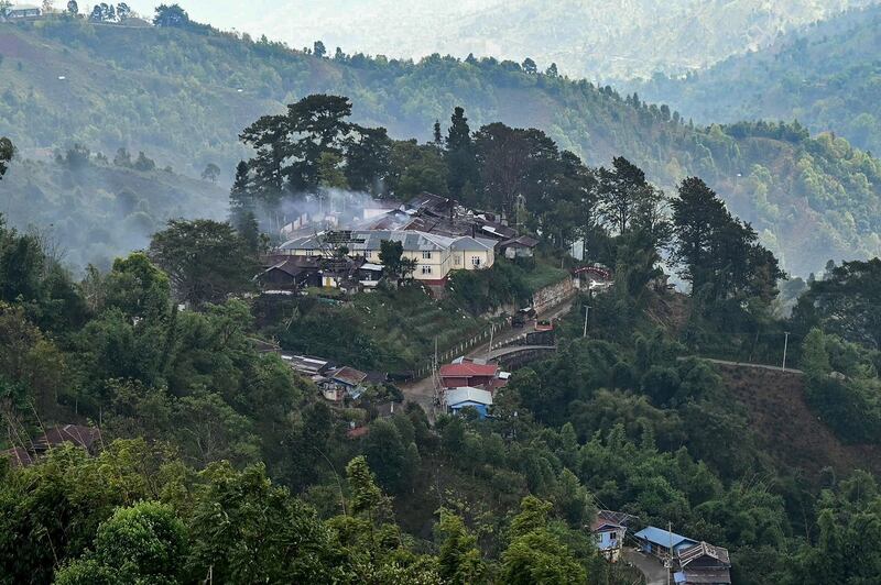 Burning Myanmar military building amid clashes with ethnic armed group Ta'ang National Liberation Army in northern Shan State, Dec. 13, 2023. (AFP Photo)
