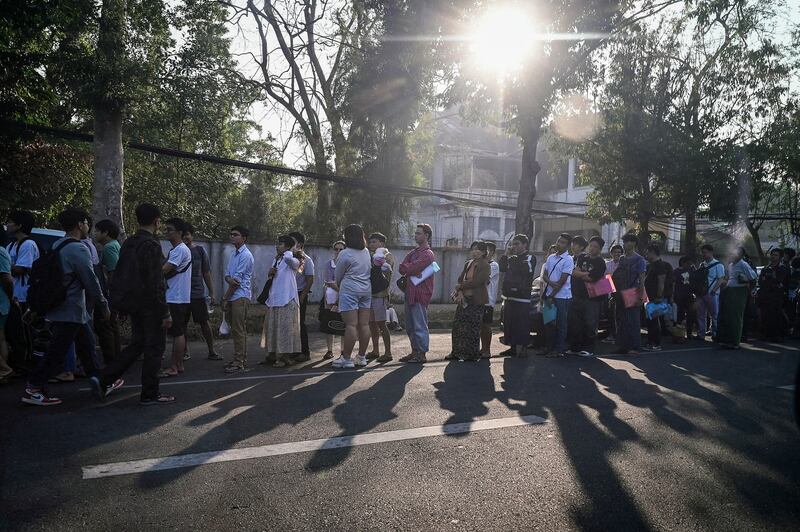 More than 1,000 people lined up to get visas at the embassy of Thailand in Yangon on Feb. 16, 2024. (AFP)