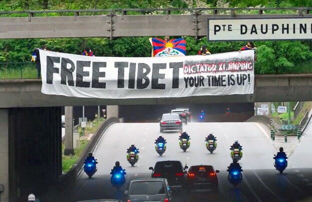 Tibetan, Uyghur protesters greet Xi Jinping in Paris