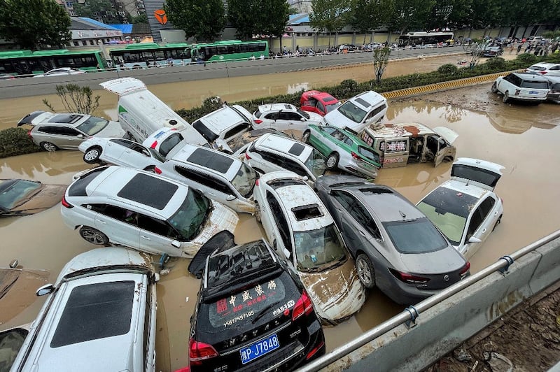 Cars sit in floodwaters after heavy rains hit the city of Zhengzhou in China's central Henan province, July 21, 2021. Credit: RFA